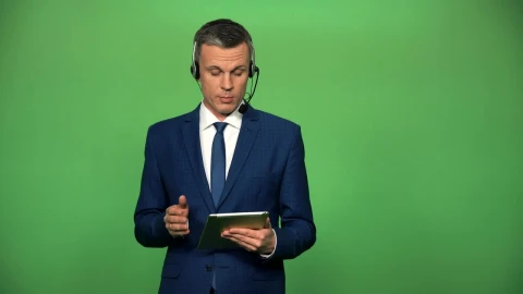 Stock Video A Businessman With A Headset And A Tablet Talking Live Wallpaper for PC - Free Live Wallpaper