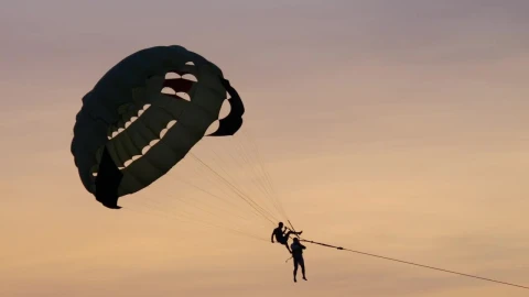 Stock Video A Couple Enjoys Parasailing In The Sunset Live Wallpaper for PC - Free Live Wallpaper
