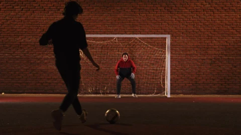 Stock Video A Couple Of Friends Playing Football At Night Live Wallpaper for PC - Free Live Wallpaper