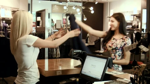 Stock Video A Couple Of Girl Friends Buying A Dress In The Live Wallpaper for PC - Free Live Wallpaper