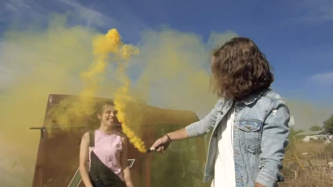 Stock Video A Couple Playing With A Yellow Smoke Bomb Live Wallpaper for PC - Free Live Wallpaper