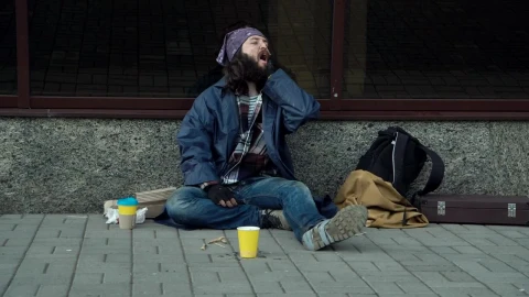 Stock Video A Drunk Homeless Man Sitting On The Street Live Wallpaper for PC - Free Live Wallpaper