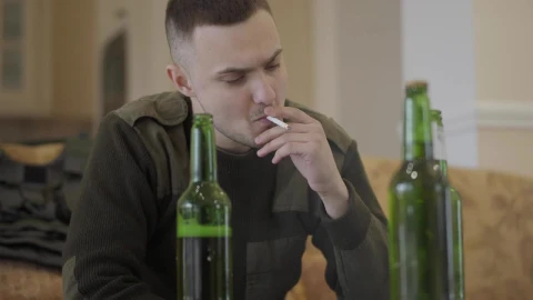 Stock Video Addict Sits On Sofa Smoking And Drinking Live Wallpaper for PC - Free Live Wallpaper