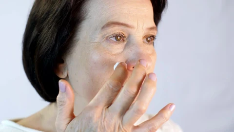 Stock Video Adult Woman Gently Putting A Cream On Her Face Live Wallpaper for PC - Free Live Wallpaper