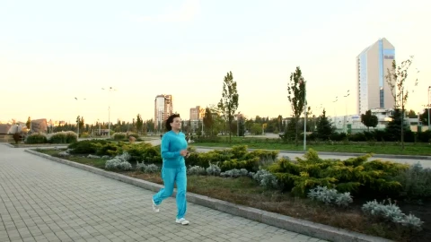 Stock Video Adult Woman Jogging Through A Large Garden  Larg Live Wallpaper for PC - Free Live Wallpaper
