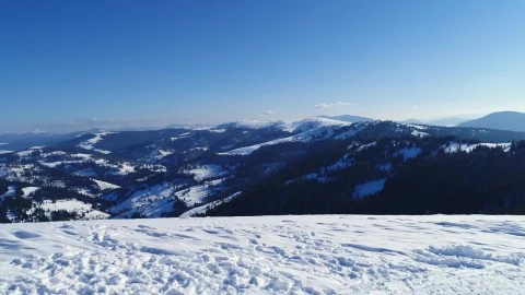 Stock Video Aerial Shot From The Top Of A Snowy Mountain Live Wallpaper for PC - Free Live Wallpaper