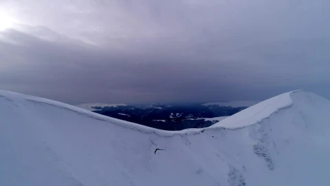 Stock Video Aerial Shot Of The Top Of A Snow Covered Mountain Live Wallpaper for PC - Free Live Wallpaper