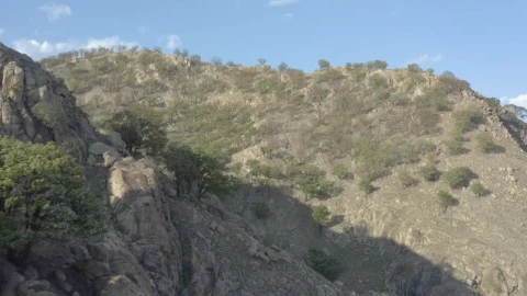 Stock Video Aerial Tour Between The Arid Hills Of A Mountain Range Live Wallpaper for PC - Free Live Wallpaper