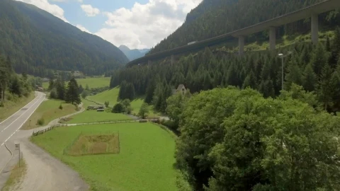Stock Video Aerial View Of Highway Around Forested Mountain Live Wallpaper for PC - Free Live Wallpaper