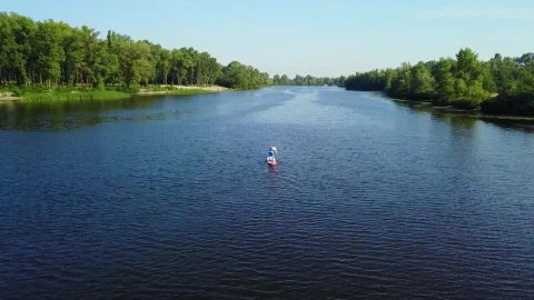 Stock Video Aerial View Of Man On Paddle Board In River Live Wallpaper for PC - Free Live Wallpaper