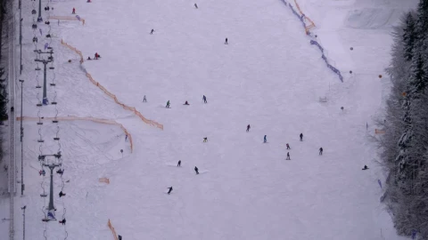 Stock Video Aerial View Of Skiers Going Down The Winter Mountain Live Wallpaper for PC - Free Live Wallpaper