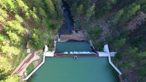 Stock Video Aerial View Over A Dam Between A Pine Forest Live Wallpaper for PC - Free Live Wallpaper