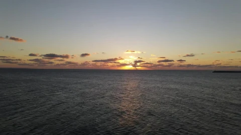 Stock Video Aerial Zoom Out Shot Of The Sea At Sunset Live Wallpaper for PC - Free Live Wallpaper