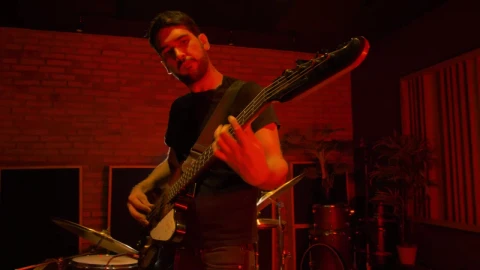 Stock Video Bass Player Playing On A Red Lit Spot Live Wallpaper For PC - Free Live Wallpaper