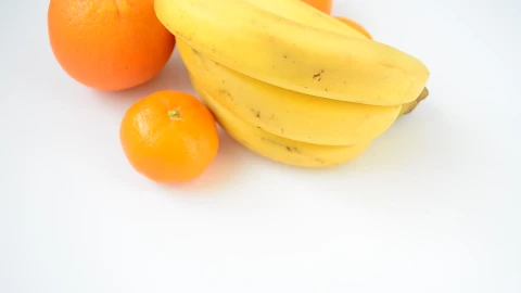 Stock Video Bananas And Oranges On White Surface Live Wallpaper For PC - Free Live Wallpaper