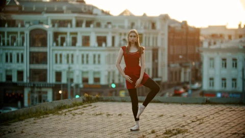 Stock Video Ballet Dancer Doing A Position High Up In A City Live Wallpaper For PC - Free Live Wallpaper
