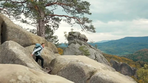 Stock Video Backpackers In Jeans Look Out Over Rustic Mountains Live Wallpaper For PC - Free Live Wallpaper
