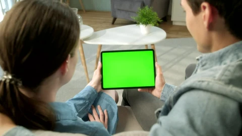 Stock Video Back View Of Couple Holding Green Screen Tablet Live Wallpaper For PC - Free Live Wallpaper