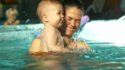 Stock Video Baby Playing In The Pool In His Moms Arms Live Wallpaper For PC - Free Live Wallpaper