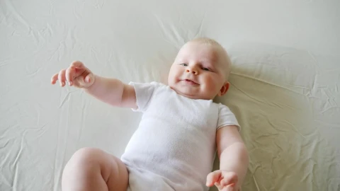 Stock Video Baby On White Bed Smiling And Reaching Live Wallpaper For PC - Free Live Wallpaper