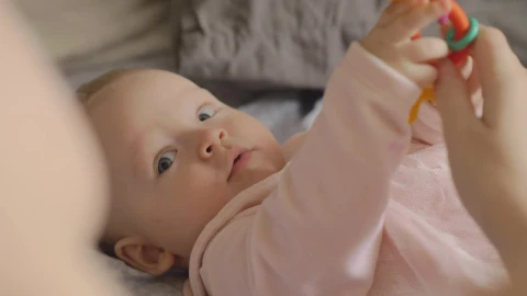Stock Video Baby Holding A Plastic Toy Live Wallpaper For PC - Free Live Wallpaper