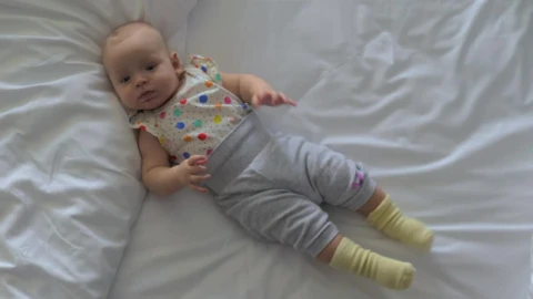 Stock Video Baby Girl Moving Around On A Bed Live Wallpaper For PC - Free Live Wallpaper
