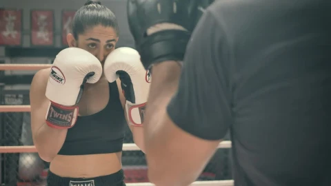 Stock Video Athletic Female Doing Kickboxing Training In A Boxing Ring Live Wallpaper For PC - Free Live Wallpaper