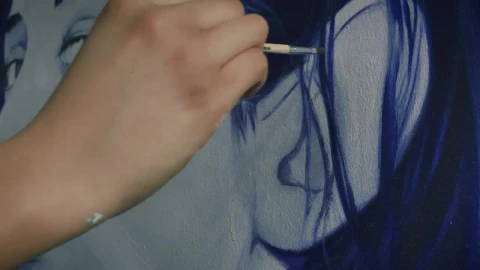 Stock Video Artists Hand Painting The Hair Of A Portrait Live Wallpaper For PC - Free Live Wallpaper
