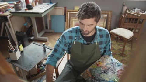 Stock Video Artist With Palette Thinks About Ideas While Looking At Canvas Live Wallpaper For PC - Free Live Wallpaper