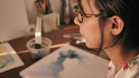 Stock Video Artist Soaking Her Paintbrush To Paint With Watercolors Live Wallpaper For PC - Free Live Wallpaper