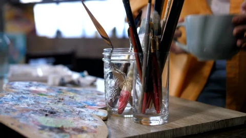 Stock Video Artist Placing A Cup Down In Their Studio Live Wallpaper For PC - Free Live Wallpaper