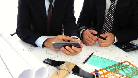Stock Video Architect Showing Pictures Of A Property To A Man Live Wallpaper For PC - Free Live Wallpaper
