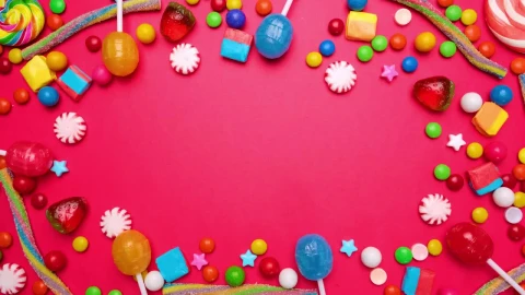 Stock Video Animated Stop Motion Frame Of Candies On A Pink Background Live Wallpaper For PC - Free Live Wallpaper