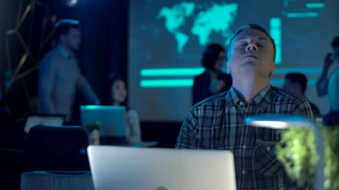 Stock Video An Exhausted Man At Work Close His Laptop Live Wallpaper For PC - Free Live Wallpaper