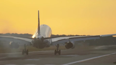 Stock Video Airplane Landing In Slow Motion In A Yellow Sky Live Wallpaper For PC - Free Live Wallpaper
