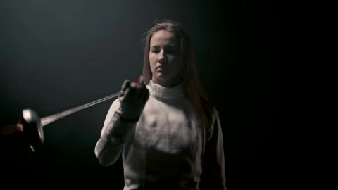 Stock Video A Young Woman Fencer Playing With Her Sword Live Wallpaper For PC - Free Live Wallpaper