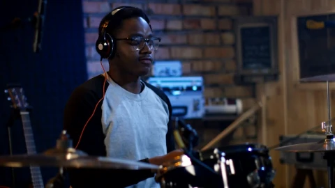 Stock Video A Young Man With Headphones Playing The Drums Live Wallpaper For PC - Free Live Wallpaper