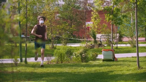 Stock Video A Young Man With A Medical Mask Exercising In The Live Wallpaper For PC - Free Live Wallpaper