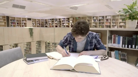 Stock Video A Young Man Studying In The Library Live Wallpaper For PC - Free Live Wallpaper