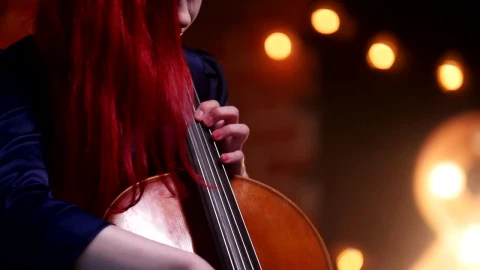 Stock Video A Woman With Red Hair Plays The Cello Live Wallpaper For PC - Free Live Wallpaper