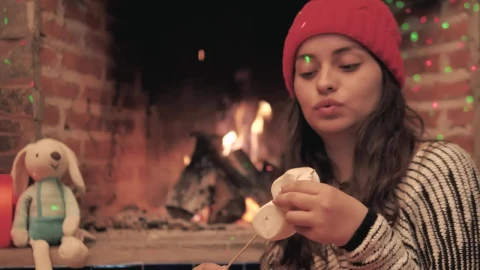 Stock Video A Woman Warms Marshmallows In The Fire Of Her Fireplace Live Wallpaper For PC - Free Live Wallpaper