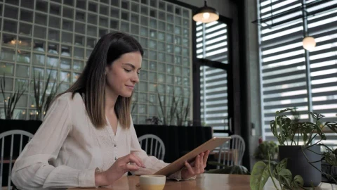 Stock Video A Woman Using A Tablet Live Wallpaper For PC - Free Live Wallpaper