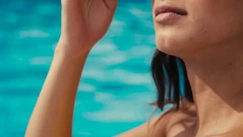 Stock Video A Woman Sitting In A Pool Wearing Sunglasses Live Wallpaper For PC - Free Live Wallpaper