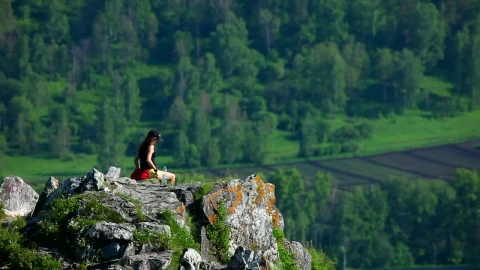 Stock Video A Woman Sitting At The Top Of The Mountain Live Wallpaper For PC - Free Live Wallpaper