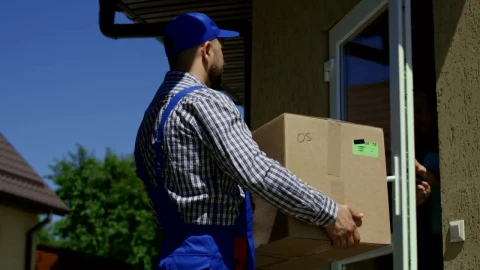 Stock Video A Woman Receives A Package From The Delivery Guy Live Wallpaper For PC - Free Live Wallpaper