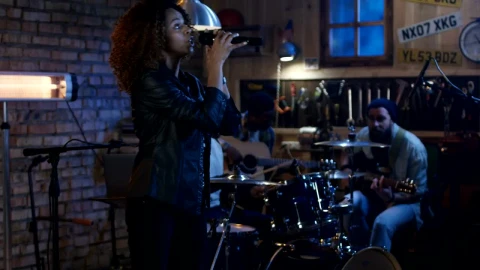 Stock Video A Woman Practicing With Band In The Garage Live Wallpaper For PC - Free Live Wallpaper
