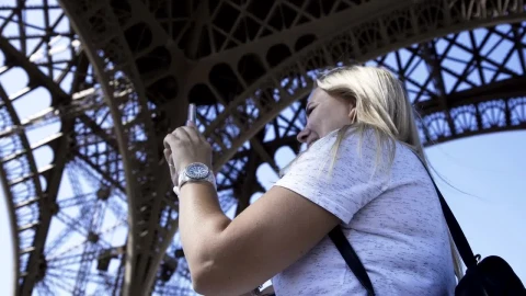 Stock Video A Woman Making A Video Call Under The Eiffel Tower Live Wallpaper For PC - Free Live Wallpaper