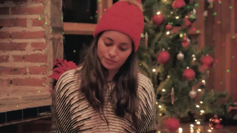 Stock Video A Woman Chooses Ornaments For Her Christmas Tree Live Wallpaper For PC - Free Live Wallpaper