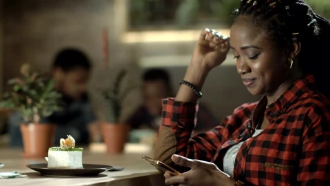 Stock Video A Woman Checking Her Phone At The Cafe Live Wallpaper For PC - Free Live Wallpaper