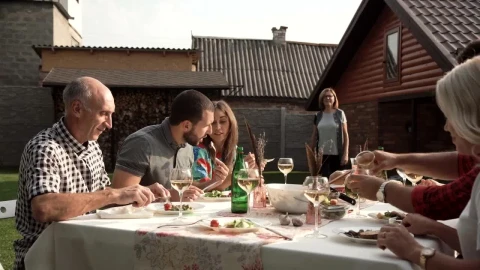 Stock Video A Woman Arrives To Family Dinner In The Backyard Live Wallpaper For PC - Free Live Wallpaper